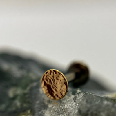 Textured yellow gold disc end on a flat-back post