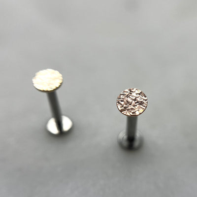 Textured gold disc ends displayed upright on flat-back posts
