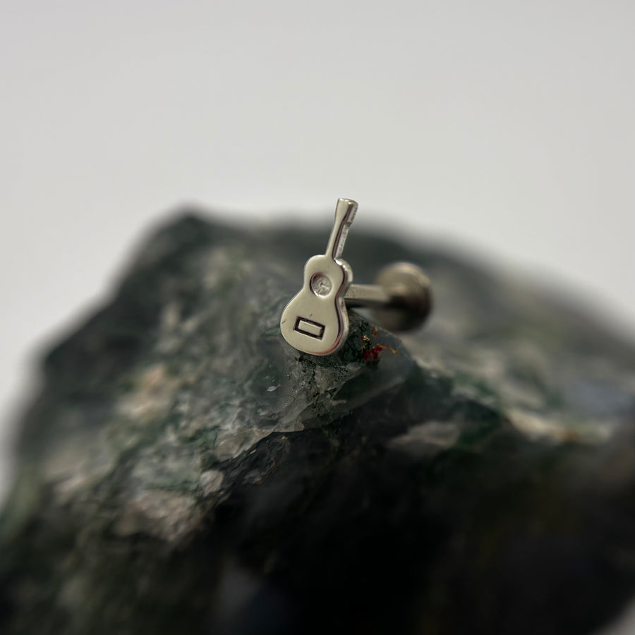 Silver guitar-shaped jewelry end on a flat-back post