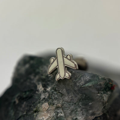 Silver airplane-shaped jewelry end on a flat-back post