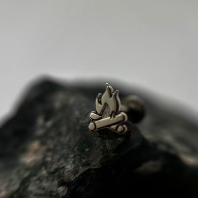 Silver campfire-shaped jewelry end with flame and log details