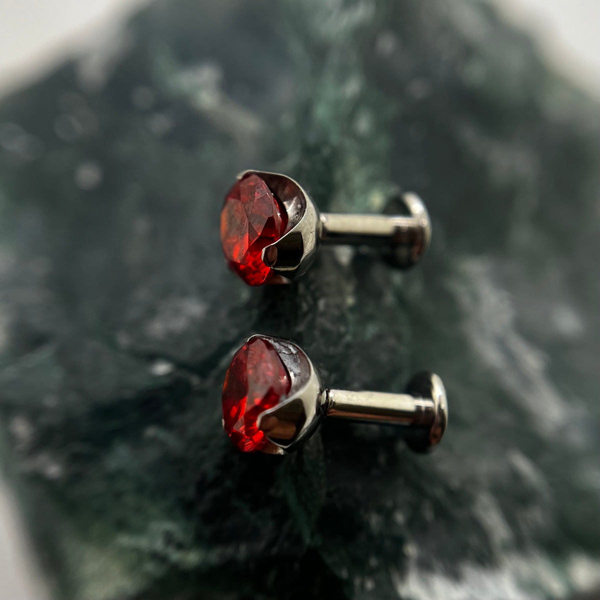 Red cubic zirconia titanium ends on flat-back posts
