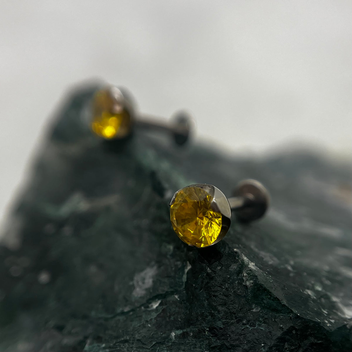 Golden yellow cubic zirconia titanium ends on flat-back posts