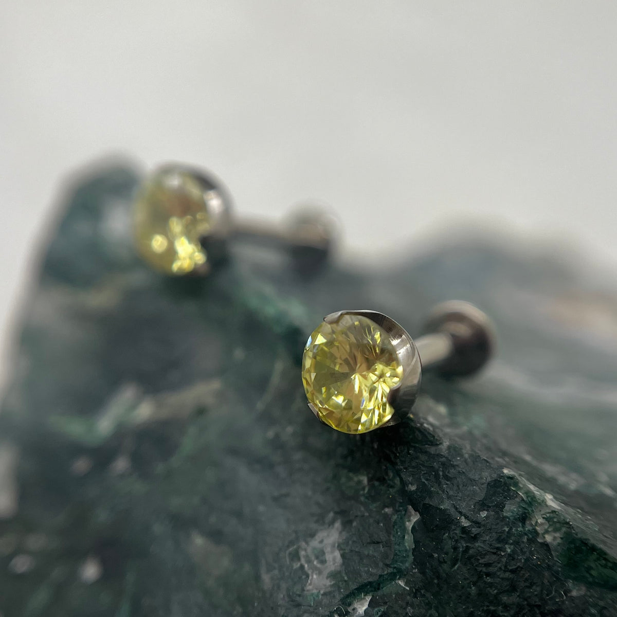Pale yellow cubic zirconia titanium ends on flat-back posts