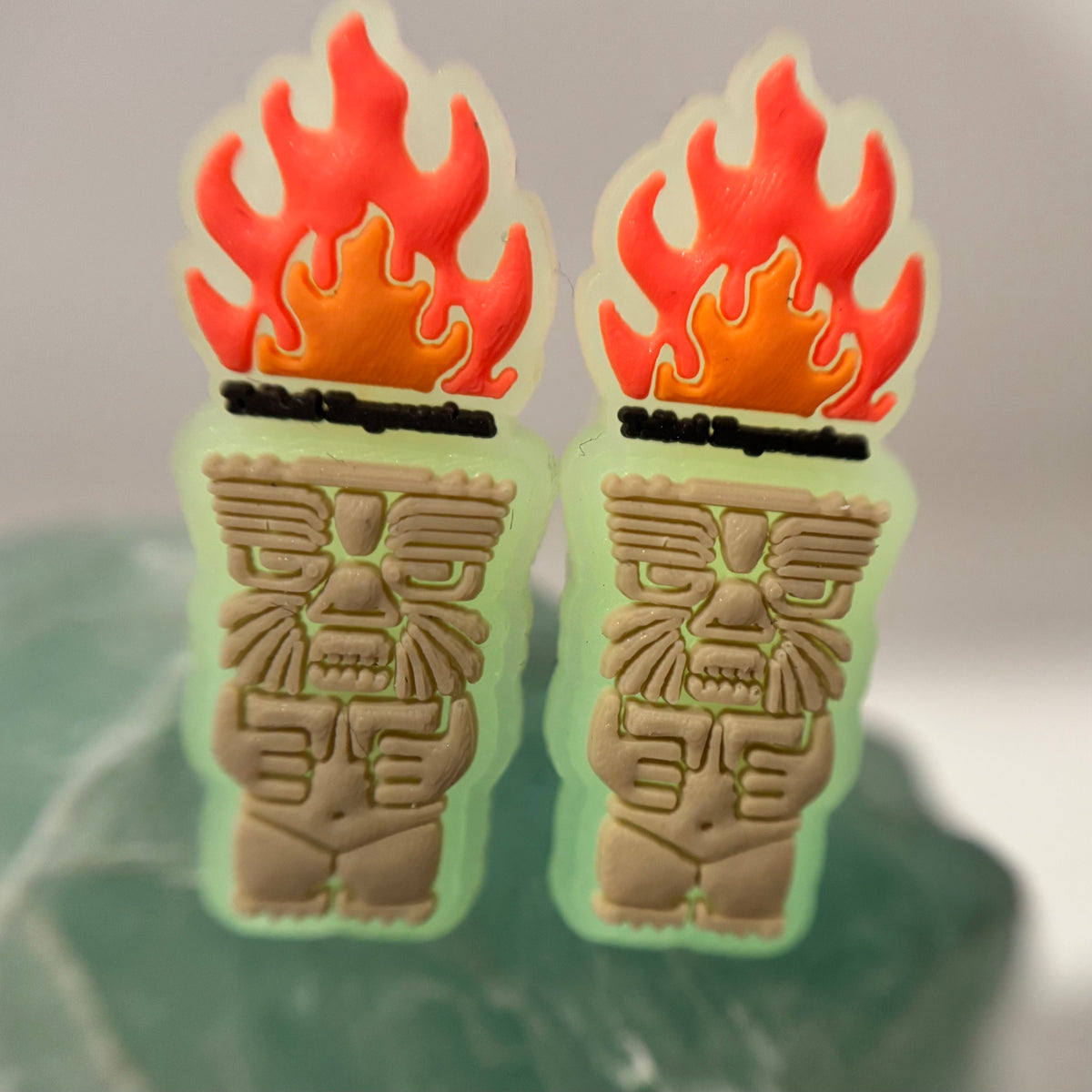 Pair of Tribal Expression flame and carved-face shoe charms