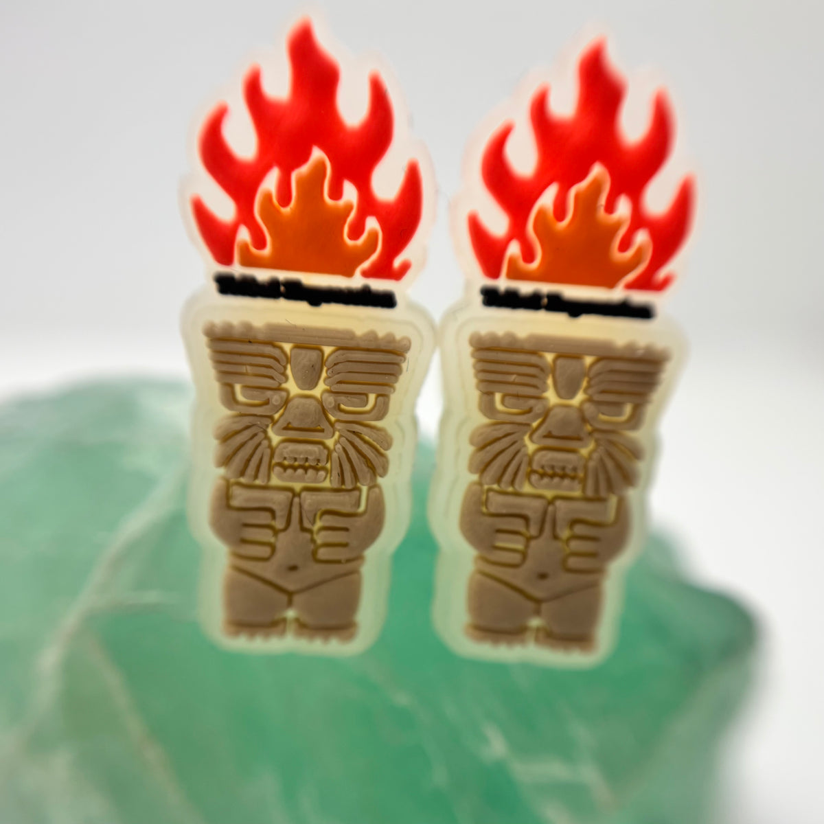 Pair of Tribal Expression flame and carved-face shoe charms