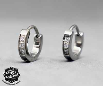 Polished titanium clicker rings with a row of clear gemstones