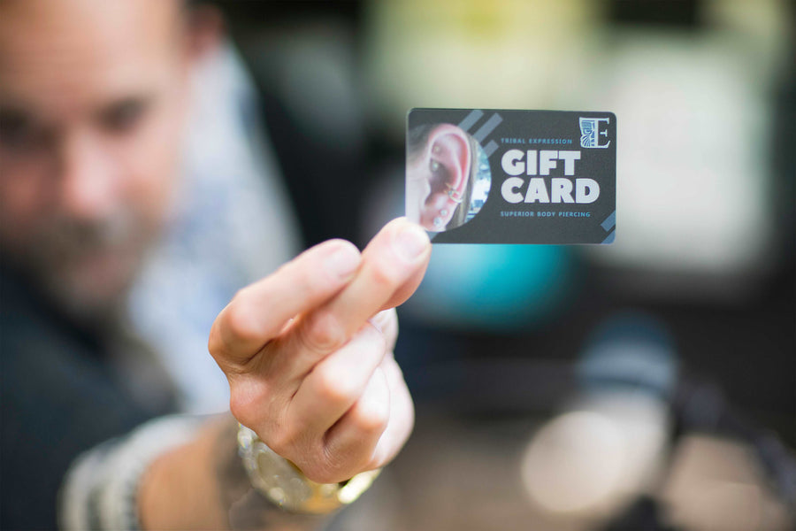 Tribal Expression gift card held in an outstretched hand
