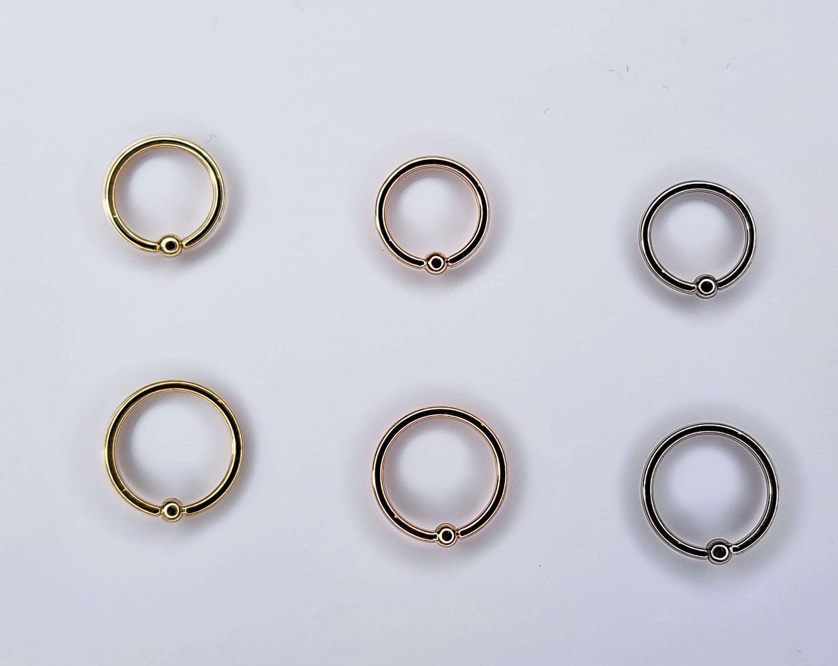 Fixed-bead seam rings in yellow, rose and white gold