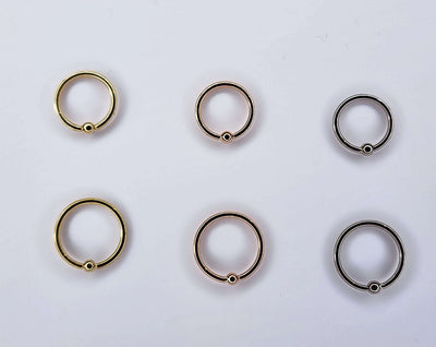 Fixed-bead seam rings in yellow, rose and white gold