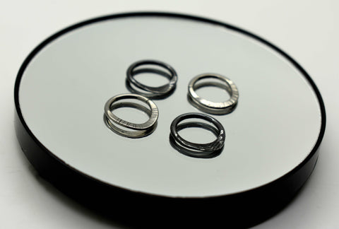 Blackened Niobium and Niobium textured hammered seam rings.