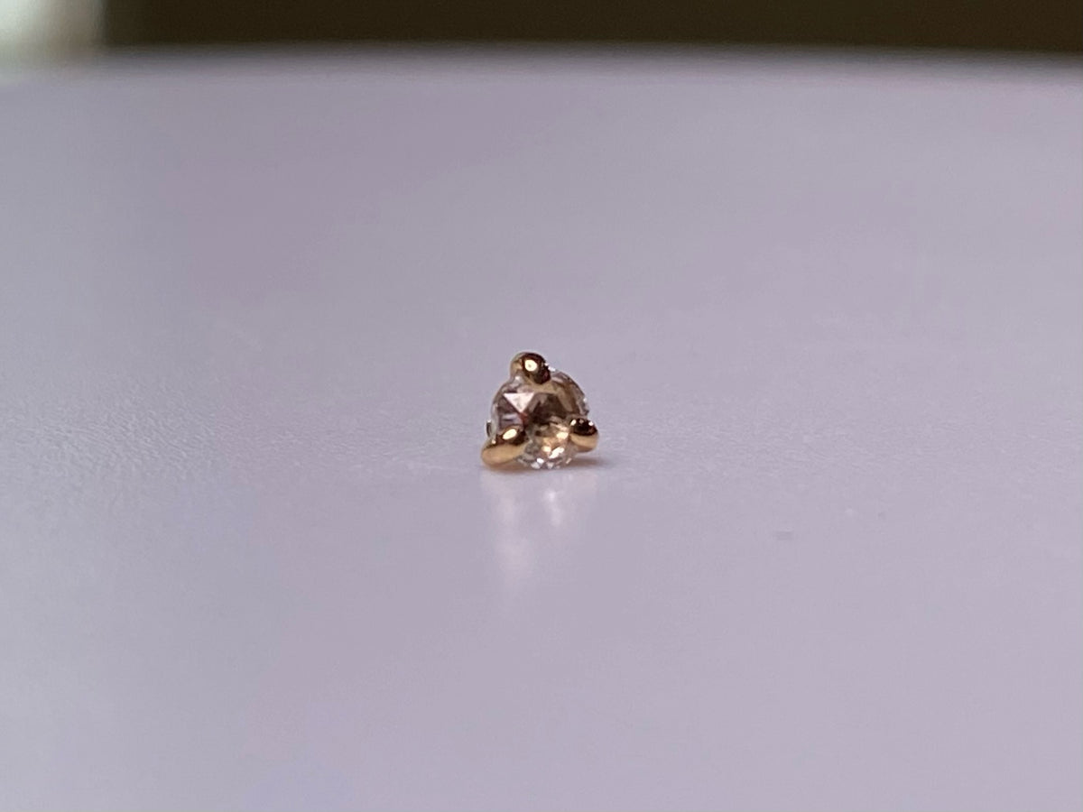Rose-cut diamond jewelry end in a three-prong rose gold setting