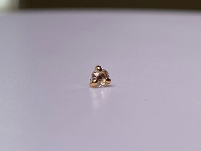 Rose-cut diamond jewelry end in a three-prong rose gold setting