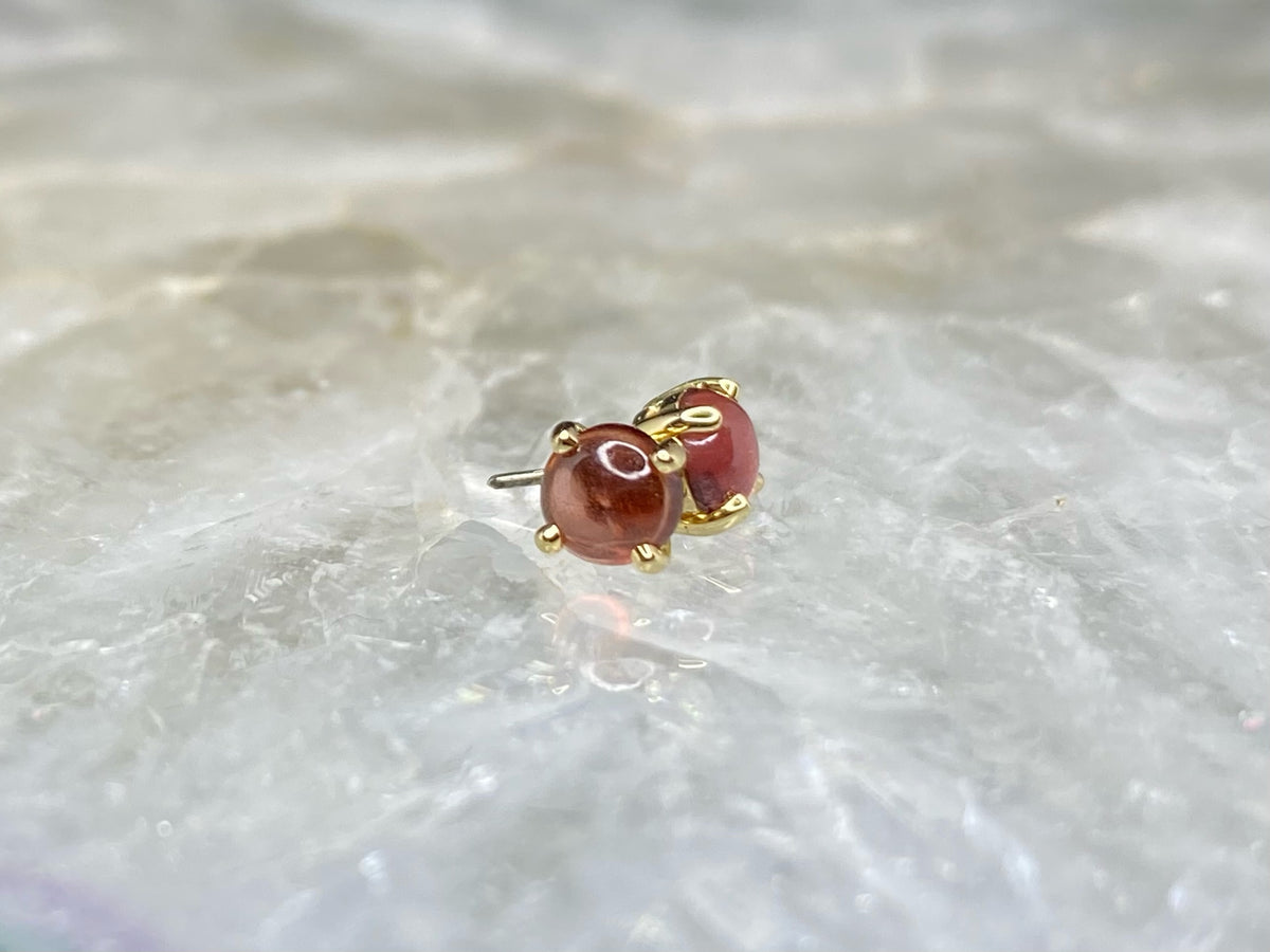 Yellow gold garnet cabochon ends with threadless pins visible
