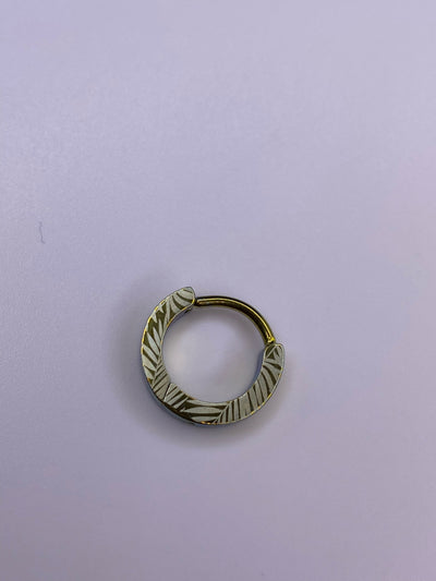 Palm Leaf titanium clicker with a gold-toned leaf pattern