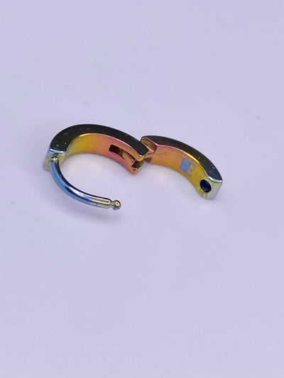 Retro titanium clicker shown with its hinge open