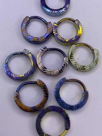 Palm Leaf titanium clickers in assorted anodized colours