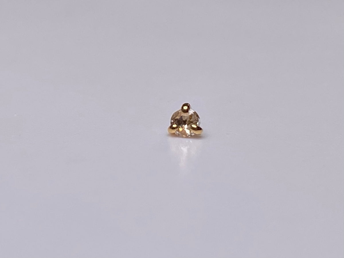 Rose-cut diamond jewelry end in a three-prong rose gold setting