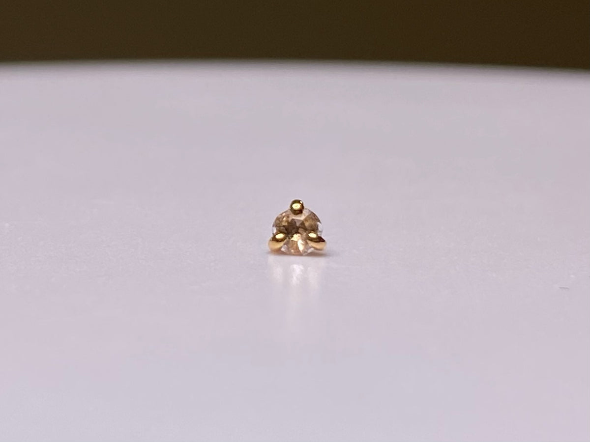 Rose-cut diamond jewelry end in a three-prong rose gold setting