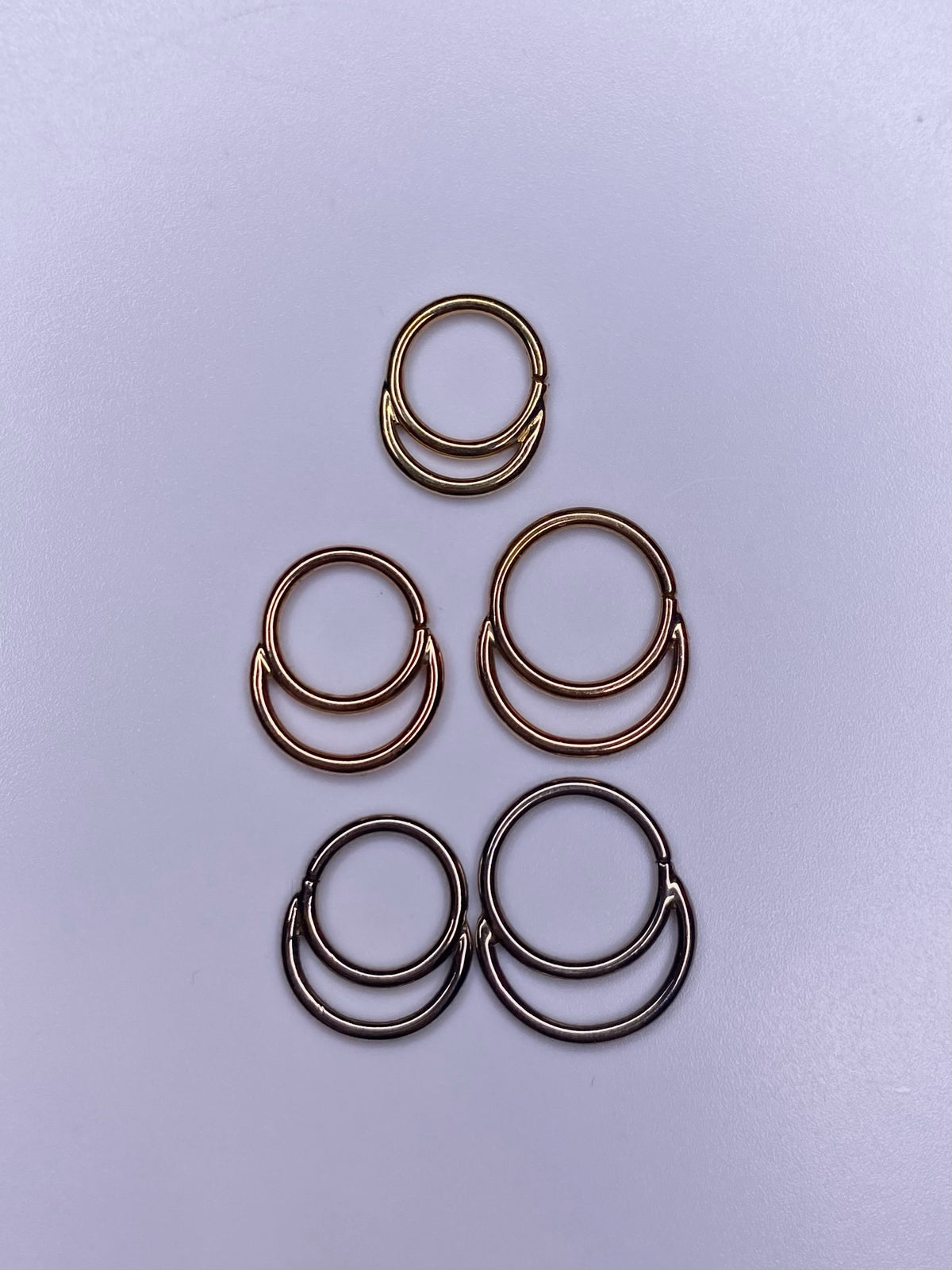Stacked seam rings in yellow, rose and white gold