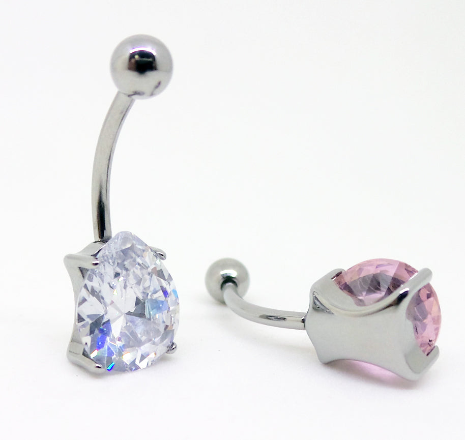 Titanium navel bars with clear and pink teardrop gemstones