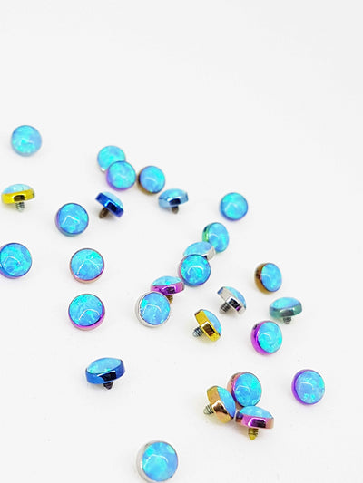 Blue opal-look titanium jewelry ends in anodized settings