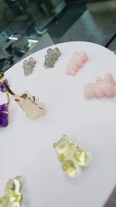 Colourful gummy bear gemstone navel jewelry on a round display
