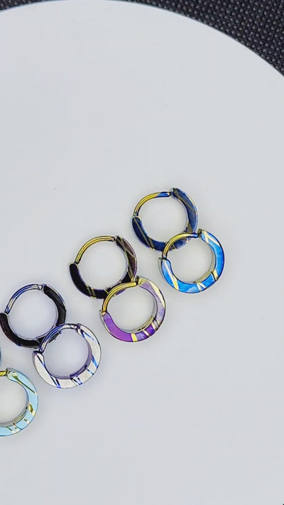 Elevated 80s titanium clickers with patterned anodized finishes