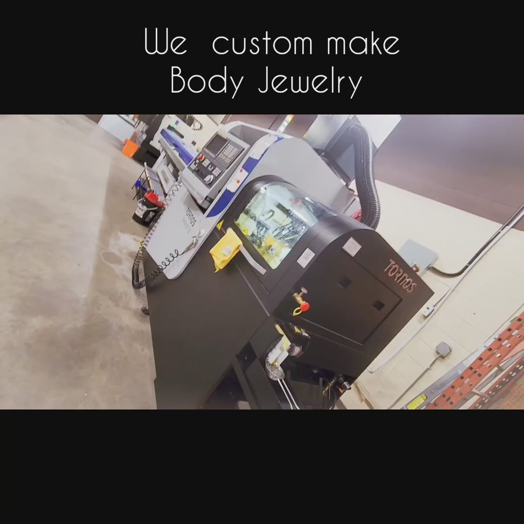 Body jewelry manufacturing machinery inside a workshop