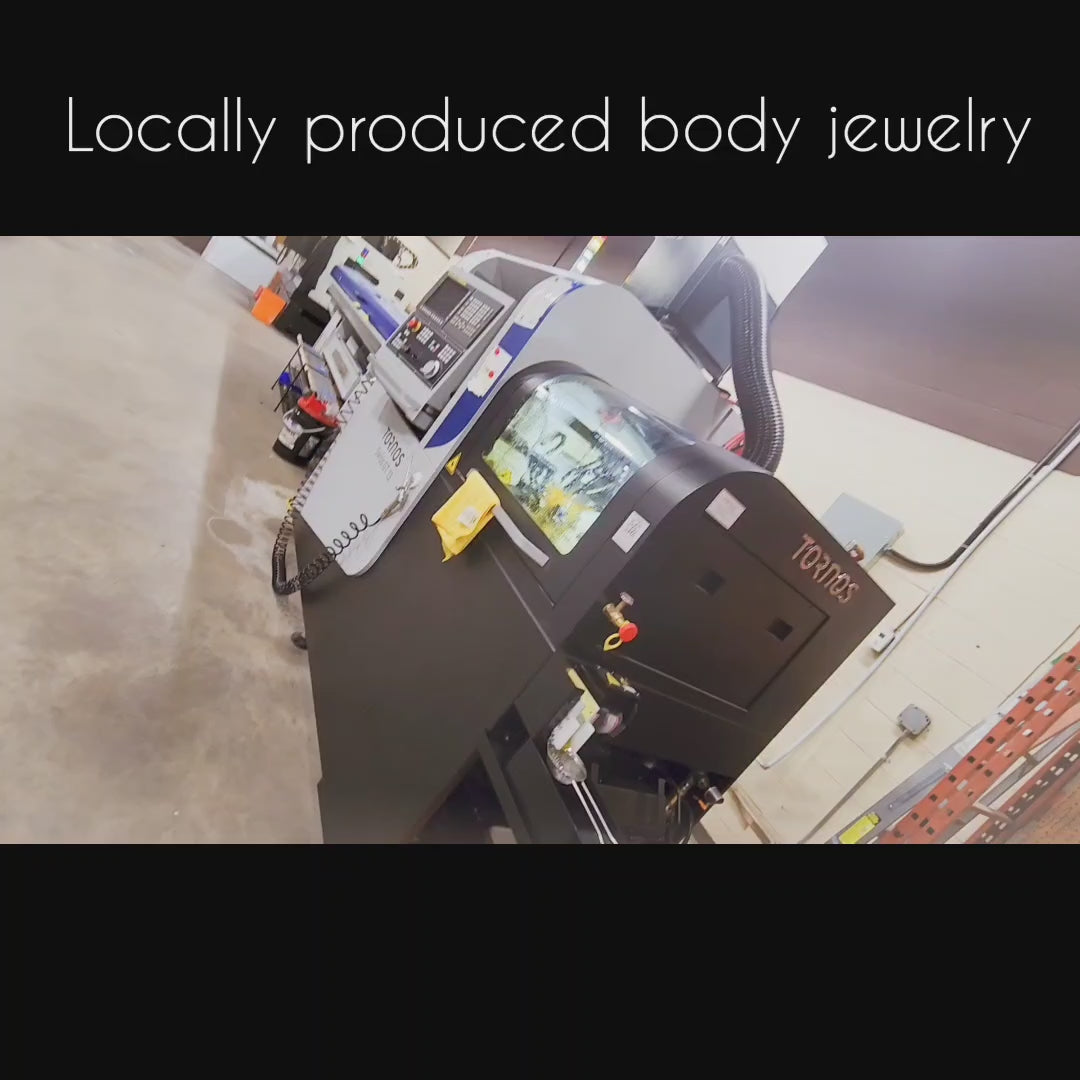 Body jewelry manufacturing machinery inside a workshop