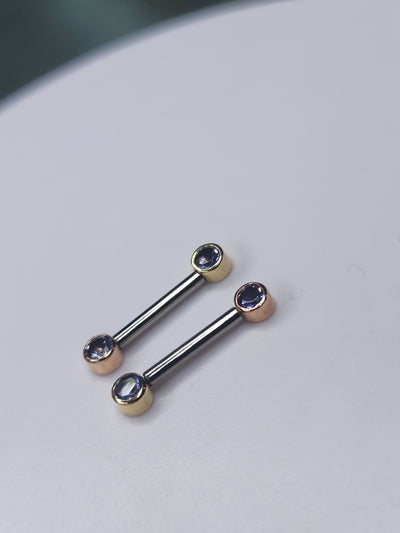 Iolite front-facing barbells with yellow and rose gold gemstone settings