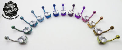Teardrop gemstone titanium navel bars arranged by anodized colour
