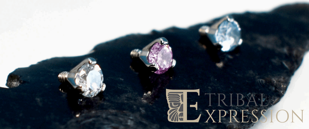 Clear, pink and blue cubic zirconia beads in three-prong titanium settings