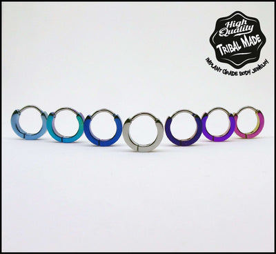 Titanium clicker rings in a row of anodized colours