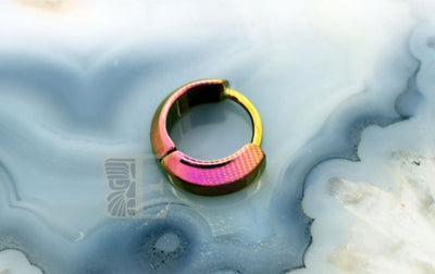 Pink and gold-toned tapered titanium clicker ring