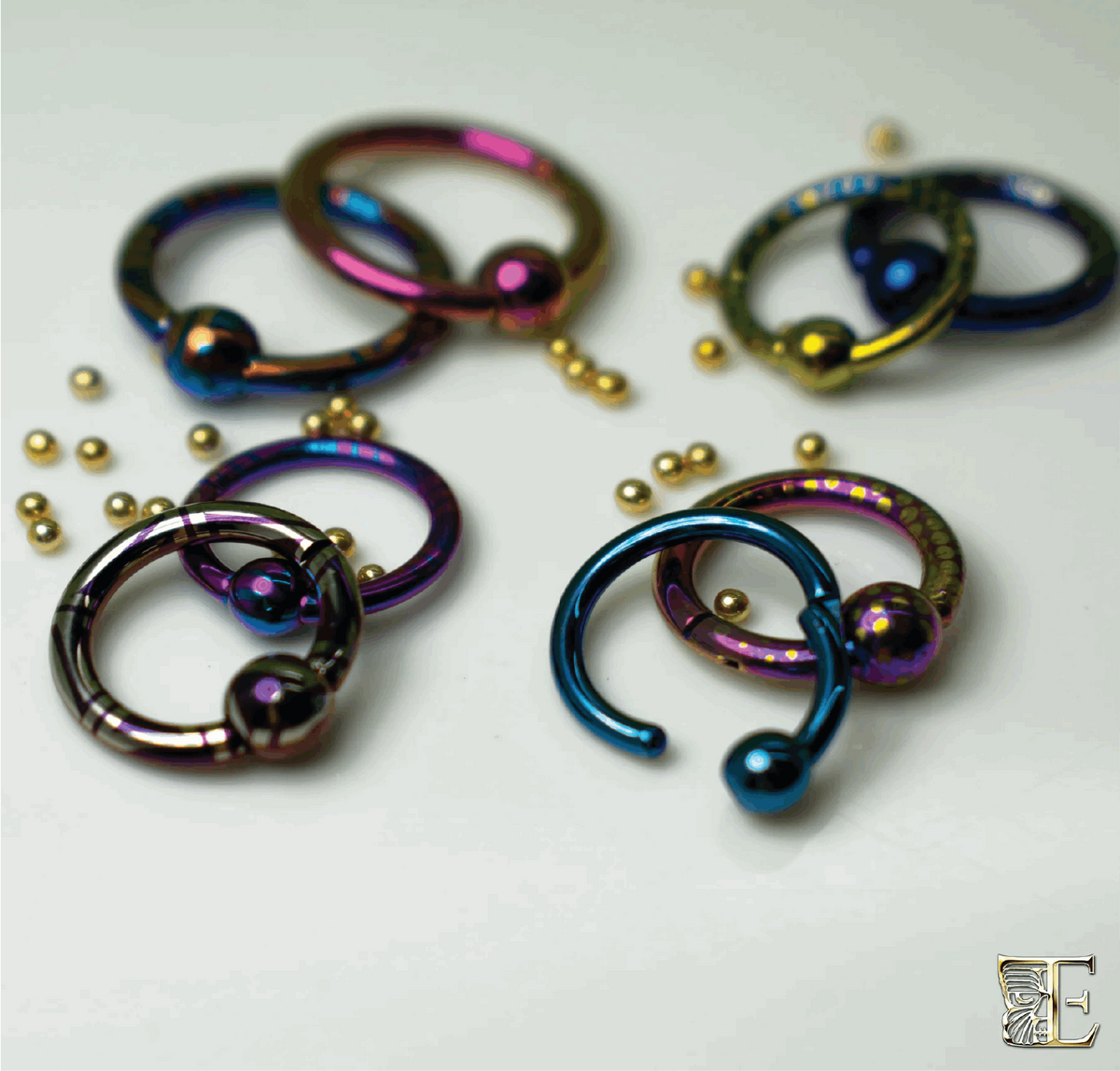 Anodized titanium captive bead rings and loose beads