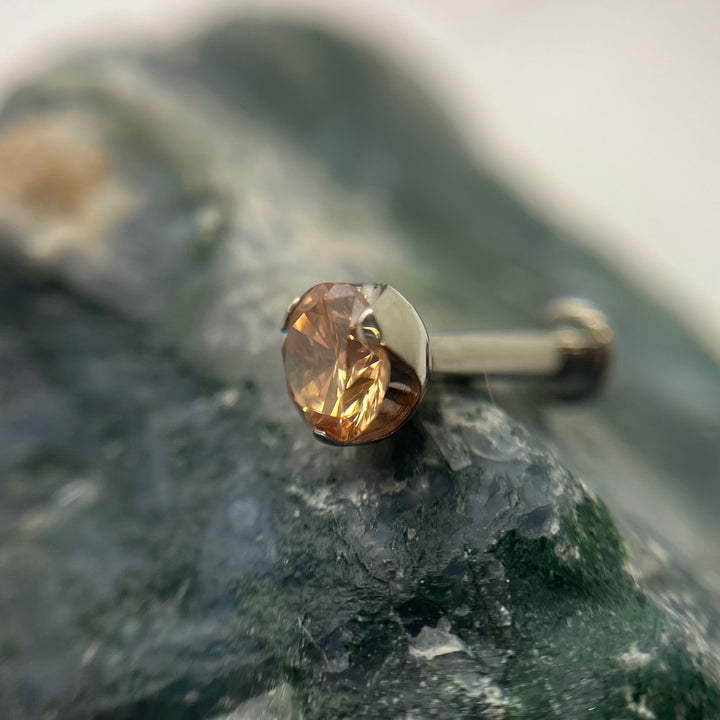 Champagne-coloured 3 mm prong-set titanium bead with backing, made in Calgary