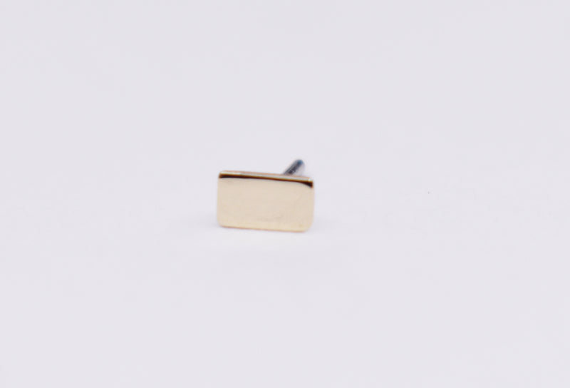 Solid 14kt Rose gold threadless top. Rectangle basic shape.