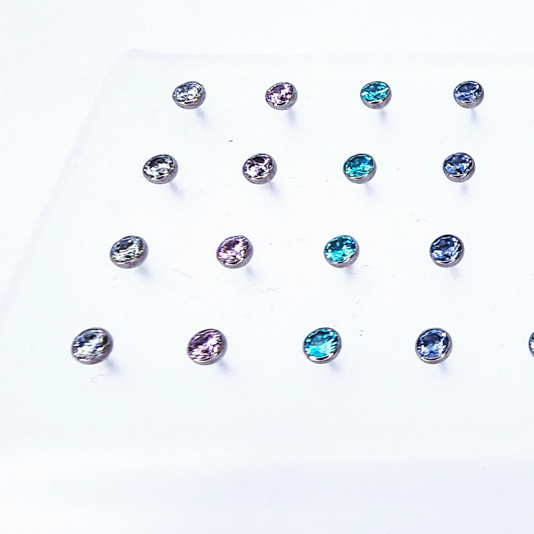 Titanium threadless gemstone ends in clear, purple and blue colours